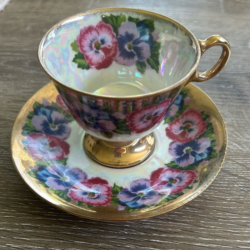 Vintage Royal Sealy Pansy pedestal teacup and saucer.